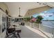 Outdoor deck with cozy seating, grill, and scenic lake views perfect for relaxing and entertaining at 141 Badin Lake Cir, New London, NC 28127