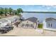 Charming lake house with a spacious driveway, a welcoming porch, and beautiful waterfront views at 141 Badin Lake Cir, New London, NC 28127