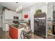 Bright kitchen boasts white cabinets, subway tile backsplash, granite countertops, and stainless steel appliances at 141 Badin Lake Cir, New London, NC 28127