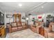 Comfortable living area featuring hardwood floors, ample seating, and seamless flow into the bright kitchen space at 141 Badin Lake Cir, New London, NC 28127