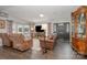 Cozy living room with hardwood floors, comfortable seating, a fireplace, and a view of the lake at 141 Badin Lake Cir, New London, NC 28127