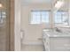 Bathroom featuring large vanity with marble countertop and decorative framed mirror at 15020 Ranson Rd, Huntersville, NC 28078