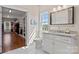 Bathroom with double vanity, tile floors, lots of natural light, a painting and access to a walk-in closet at 15020 Ranson Rd, Huntersville, NC 28078
