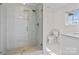 Bathroom featuring glass enclosed shower, tiled flooring, and marble countertop at 15020 Ranson Rd, Huntersville, NC 28078