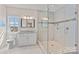 Bathroom with glass shower, white vanity with granite countertop, and decorative mirror at 15020 Ranson Rd, Huntersville, NC 28078