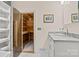 Bathroom with a sauna, white vanity with granite countertop, and a glass enclosed sauna at 15020 Ranson Rd, Huntersville, NC 28078