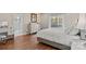 Bedroom featuring hardwood floors, neutral walls, and dresser at 15020 Ranson Rd, Huntersville, NC 28078