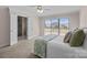 Well-lit bedroom includes en suite bathroom access and sliding doors to a private deck at 15020 Ranson Rd, Huntersville, NC 28078