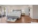 Bedroom featuring wood floors, neutral walls, and decorative bedside tables at 15020 Ranson Rd, Huntersville, NC 28078