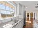 Bright kitchen with granite counters and stainless steel appliances plus an exterior view at 15020 Ranson Rd, Huntersville, NC 28078