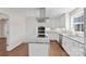 Bright kitchen with white cabinets, stainless steel appliances, granite countertops, and a center island at 15020 Ranson Rd, Huntersville, NC 28078