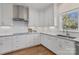 Kitchen with stainless vent hood, granite countertops and white cabinets at 15020 Ranson Rd, Huntersville, NC 28078
