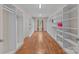Spacious walk-in closet with custom shelving, hardwood floors, a window and lots of storage space at 15020 Ranson Rd, Huntersville, NC 28078