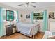 Cozy bedroom featuring wood floors, a decorative window, and a relaxing ambiance at 151 Cynthia St, Statesville, NC 28677