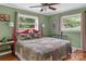 Comfortable bedroom with natural light, hardwood floors, and neutral paint colors at 151 Cynthia St, Statesville, NC 28677
