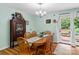 Light-filled dining room with wooden table, chairs, and a view of the outdoor patio at 151 Cynthia St, Statesville, NC 28677