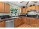 Updated kitchen featuring wood cabinets, black backsplash, and stainless steel appliances at 151 Cynthia St, Statesville, NC 28677