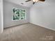 Bedroom featuring a large window with natural light and plush carpeting at 1573 Maypine Commons Way, Rock Hill, SC 29732