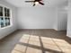 Carpeted bedroom with ceiling fan and large window at 1573 Maypine Commons Way, Rock Hill, SC 29732
