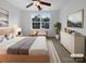 Cozy bedroom features ceiling fan, window view, and neutral décor at 1573 Maypine Commons Way, Rock Hill, SC 29732