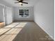 Carpeted bedroom with ceiling fan and large window at 1573 Maypine Commons Way, Rock Hill, SC 29732