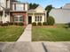 Charming townhome with brick and siding, manicured lawn, and walkway to front door at 1573 Maypine Commons Way, Rock Hill, SC 29732