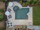 Aerial view of a backyard featuring a swimming pool, lounge area, spa and manicured landscaping at 1619 Providence Rd, Charlotte, NC 28207