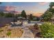 Backyard with a stone walkway to the pool, surrounded by landscaping and comfortable seating at 1619 Providence Rd, Charlotte, NC 28207