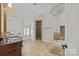 Elegant bathroom featuring granite countertops, walk-in shower, and soaking tub at 1619 Providence Rd, Charlotte, NC 28207