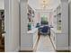 Dedicated home office space with bookshelves, built-in cabinets, and a bright window at 1619 Providence Rd, Charlotte, NC 28207
