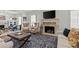 Inviting living room featuring a stone fireplace, plush seating, and elegant decor at 1619 Providence Rd, Charlotte, NC 28207