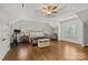 Large main bedroom with tray ceiling, hardwood floors, and natural light from windows at 1619 Providence Rd, Charlotte, NC 28207