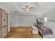 Spacious main bedroom featuring tray ceiling, hardwood floors, and custom closet doors at 1619 Providence Rd, Charlotte, NC 28207
