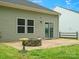 An outdoor patio offers a fire pit and a view of the grassy lawn and partial fencing at 1660 Beleek Ridge Ln, Lake Wylie, SC 29710