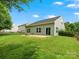 The backyard features a patio, a well-manicured lawn, and partial fencing at 1660 Beleek Ridge Ln, Lake Wylie, SC 29710