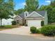 Lovely single-Gathering home with an attached garage, manicured lawn, and colorful landscaping at 1660 Beleek Ridge Ln, Lake Wylie, SC 29710