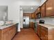 Open kitchen with stainless steel appliances, granite counters, and ample cabinet space at 1660 Beleek Ridge Ln, Lake Wylie, SC 29710