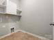 Practical laundry room with tile flooring and essential hookups at 1660 Beleek Ridge Ln, Lake Wylie, SC 29710