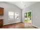 Bright living room with hardwood floors and large windows at 1660 Beleek Ridge Ln, Lake Wylie, SC 29710