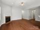 Spacious living room featuring hardwood floors, a fireplace, and open access to other areas of the home at 1660 Beleek Ridge Ln, Lake Wylie, SC 29710