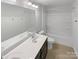 Well-lit bathroom with a double vanity, large mirror, and shower-tub combination at 1680 Trentwood Dr, Fort Mill, SC 29715