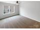 A sunny bedroom has large windows and neutral walls and carpet at 1680 Trentwood Dr, Fort Mill, SC 29715
