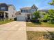 Charming two-story home with a well-maintained lawn and attached two-car garage at 1680 Trentwood Dr, Fort Mill, SC 29715