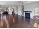 Open-concept living area with hardwood floors, fireplace, and seamless flow to the kitchen at 1680 Trentwood Dr, Fort Mill, SC 29715