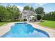 Beautiful backyard with in-ground pool, large deck and entertainment area at 175 Turnberry Ln, Mooresville, NC 28117