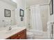 Bright bathroom showcasing vanity, toilet, and tub with shower featuring neutral tones at 175 Turnberry Ln, Mooresville, NC 28117