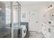 Inviting bathroom featuring glass enclosed shower, bathtub and vanity with white cabinets at 175 Turnberry Ln, Mooresville, NC 28117