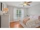 Cozy bedroom with hardwood floors, bright window and ceiling fan at 175 Turnberry Ln, Mooresville, NC 28117