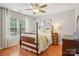Charming bedroom features a four-poster bed, wood floors, and a bright window at 175 Turnberry Ln, Mooresville, NC 28117