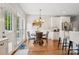 Bright breakfast nook with a modern chandelier and white cabinets at 175 Turnberry Ln, Mooresville, NC 28117